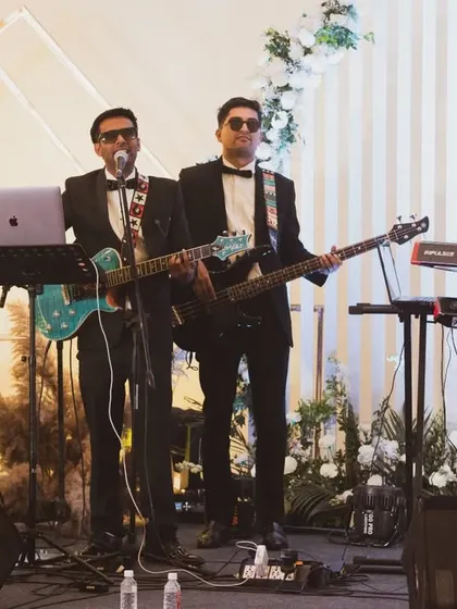 The band in action during a wedding performance. Notice the coordination and energy we bring to every song, ensuring a captivating show from start to finish.