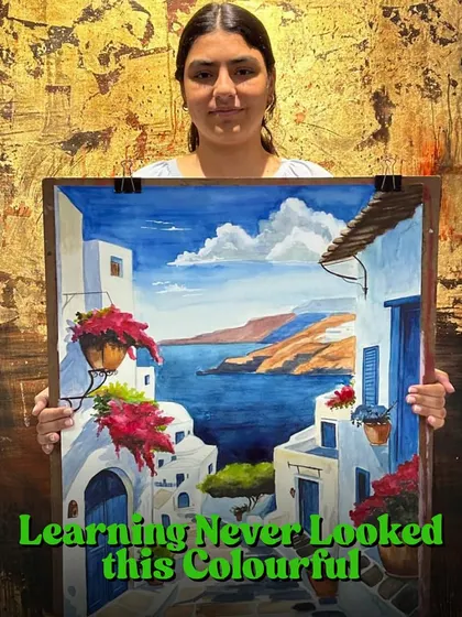 Learning never looked this colorful. This student is showcasing her vibrant painting of a coastal town, a testament to her hard work and newfound skills.