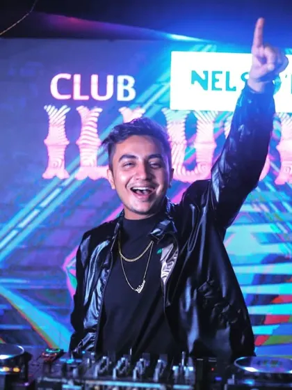 A classic DJ pose at Club Illusions. I love the energy of a club when the lights are just right and the music is hitting hard.