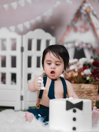 The aftermath of a successful cake smash. This little guy is taking his job as official cake taster very seriously, and I was there to capture every funny, messy moment.