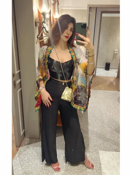 How to re-style a festive look. I paired the printed cape from a lehenga set with a black corset and trousers for a chic, Indo-Western party outfit.