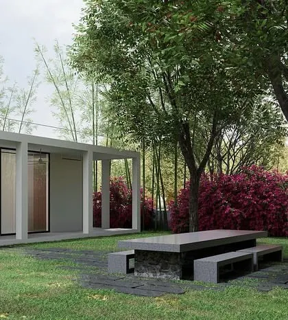 This small weekend retreat was designed to be a private, quiet, and reclusive space. The minimalist, neutral architecture intentionally steps back, allowing the lush surrounding landscape with its dense bamboo and flowering shrubs to become the main focus and create a sense of total immersion in nature.