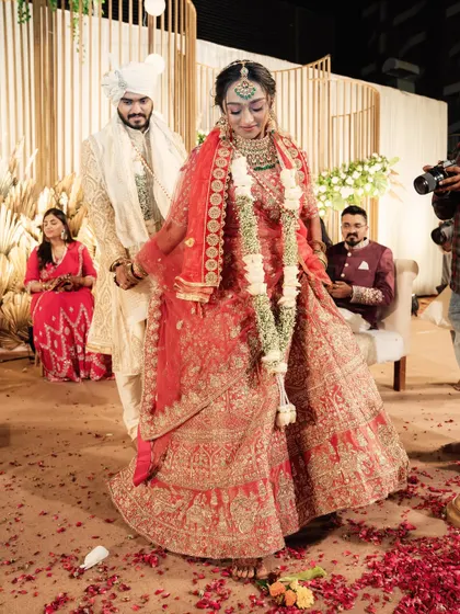 The bride and groom taking their first steps as a married couple, walking on a carpet of rose petals. It's these final touches that make the moment perfect.