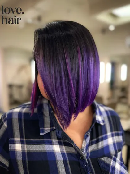 A sharp, angled bob with a vibrant purple balayage. This look is edgy, modern, and full of personality.