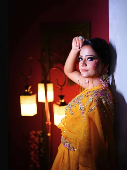 A dramatic portrait in the yellow Haldi lehenga, showing its versatility.