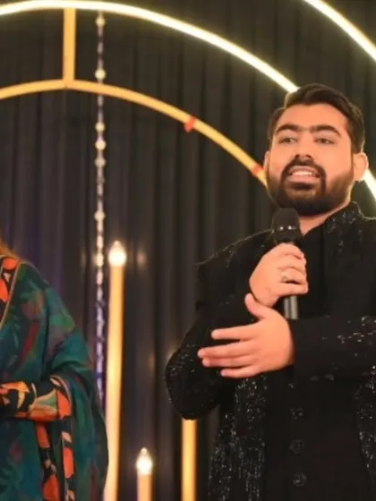 Sharing the mic with a guest during a Sangeet performance. It's all about creating an inclusive environment where family and friends can share their talents and celebrate the couple.