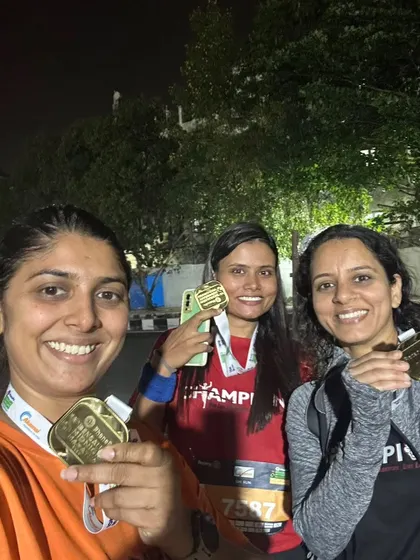 Three of our runners proudly showing off their medals after the Bengaluru Midnight Marathon. A unique and challenging race that our team aced.