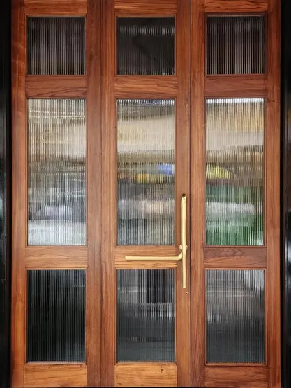 The bespoke teak wood and fluted glass door we designed for Americano restaurant in Mumbai. The warm wood and brass handle create a welcoming entrance that feels both classic and contemporary.