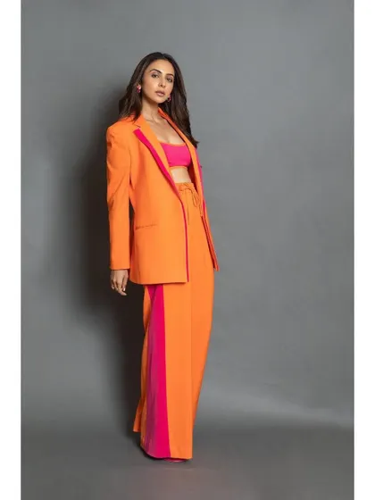 The full look, showing how the bright pink crop top ties the whole outfit together.