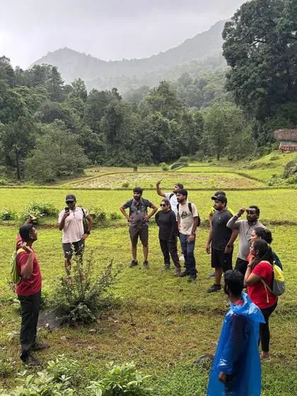 Briefing the group before we start our trek through the green paddy fields of a Malnad village. I always explain the trail, the local context, and safety precautions to ensure a smooth journey.