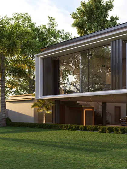 This view captures the outhouse at sunset, with its illuminated outline creating a beacon of modern design. The transparency of the upper floor makes it feel like a lantern in the garden.