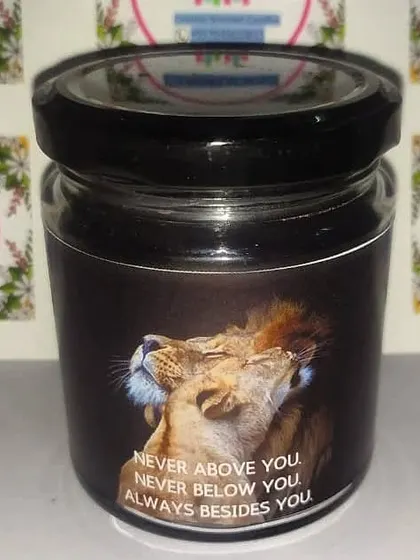 A perfect gift for your partner or a favorite couple. This scented jar candle features a powerful image and the quote "Never above you. Never below you. Always besides you."