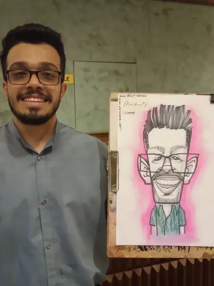 A guest from the New Year's Day event at Mr. Merchant, looking sharp in his caricature.