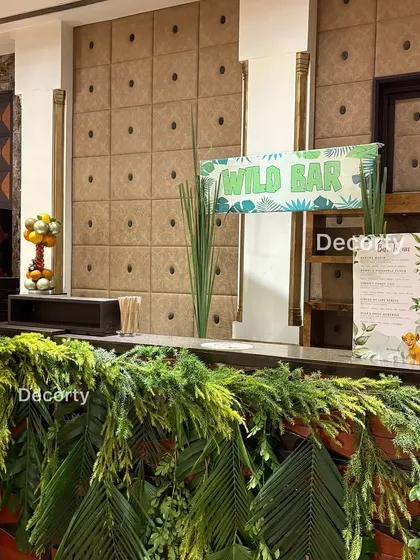 A detailed shot of the 'Wild Bar', showing the custom menu signs and fruit arrangements that add to the theme.