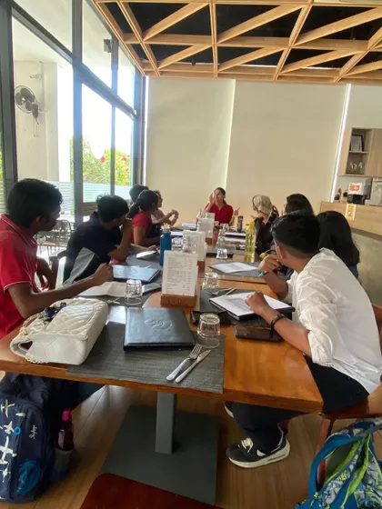 A full view of our off site class at a restaurant. This change of scenery helps students practice ordering food and making conversation in a practical, real world setting.