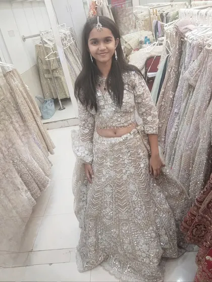 Another angle of our young client looking happy in her chosen outfit.