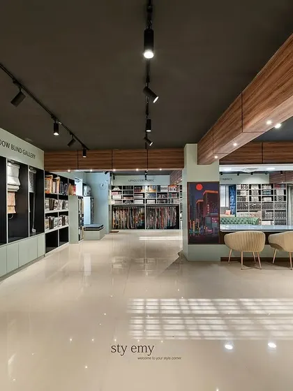 A different perspective of the main showroom floor. The layout is designed to be open and easy to navigate, encouraging customers to explore the various fabric and furniture displays without feeling crowded.