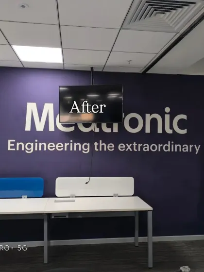 After: A bold, purple brand wall with the company logo and tagline, creating a strong corporate identity.
