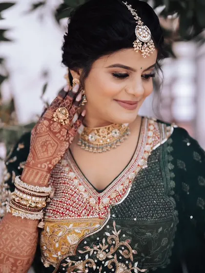 A close-up of her carnival makeup. The look is soft and glowing, letting her natural beauty and the detailed outfit shine.