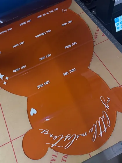 Zooming into the magic of the teddy bear milestone board. This project involved 3D cutouts, a scalloped banner with the baby's initial, and UV printing on an acrylic base, a new technique I was excited to try.