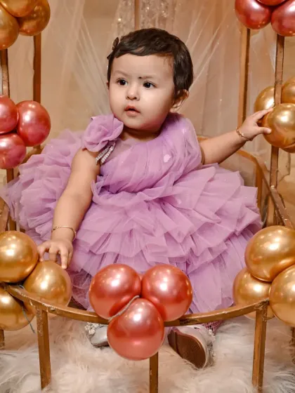 A posed yet natural portrait from a first birthday photoshoot. Even in a set-up, I look for genuine expressions to ensure the photos feel authentic and full of life.