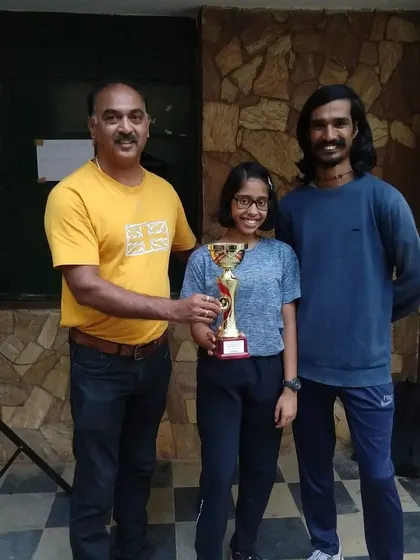 Our player Kaira Baliga with her coaches after winning the gold medal in the U-15 category at the state ranking tournament.