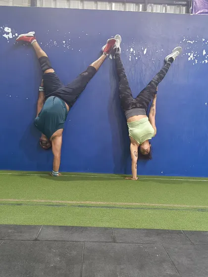 Working on gymnastics skills like handstands not only builds incredible upper body and core strength but also improves balance and spatial awareness. Plus, it's always fun to push each other to get better.