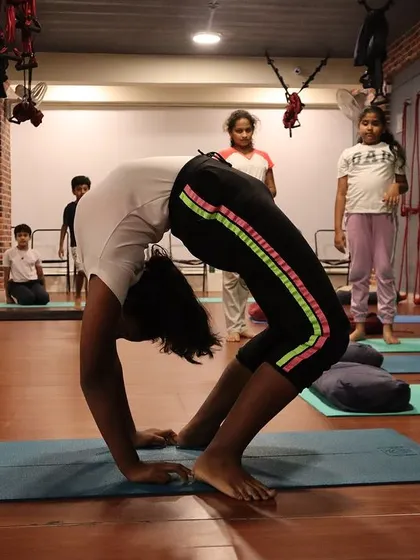 A strong and stable wheel pose, demonstrating excellent shoulder and thoracic spine mobility.