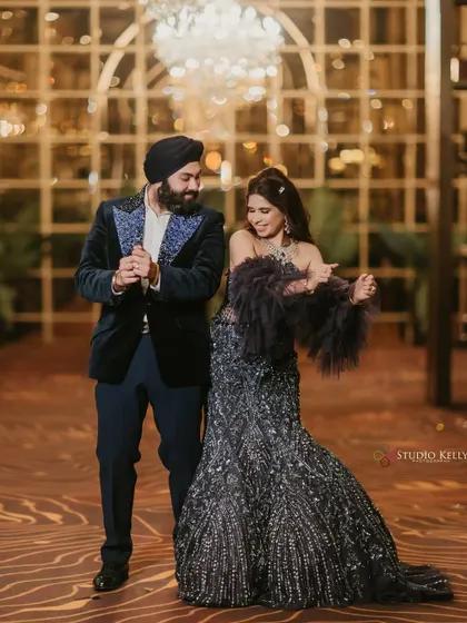 A candid shot of the couple dancing and enjoying their glamorous reception.