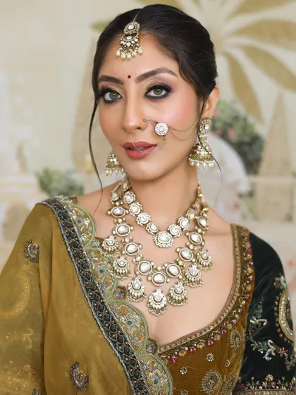A close-up of a radiant and elegant bridal look, perfect for the big day. The makeup features a smokey eye and a flawless base.
