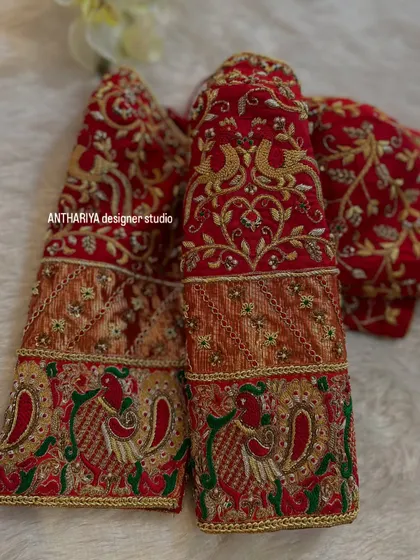 A close-up of the sleeves, showing the beautiful peacock and paisley motifs.