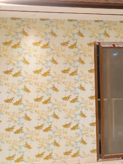 Another example of a delicate yellow and grey branch pattern, adding a soft and natural touch to this room.