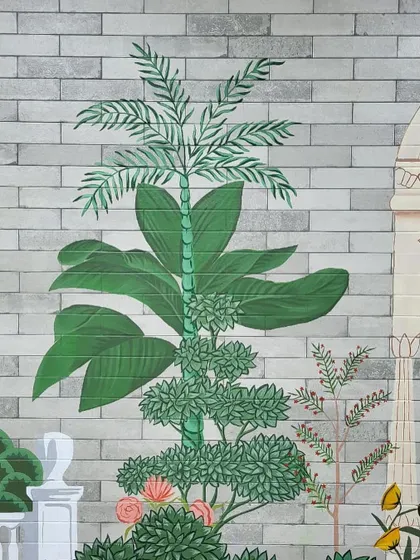 Another detailed view of the painted foliage in the tropical Mughal-themed mural.