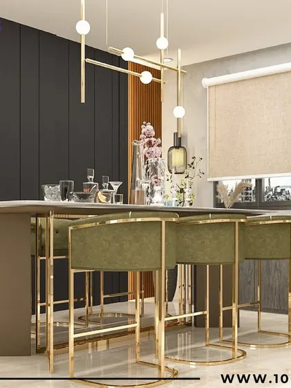 A high-top dining table with olive green and gold bar stools, perfect for casual dining or entertaining guests in style.