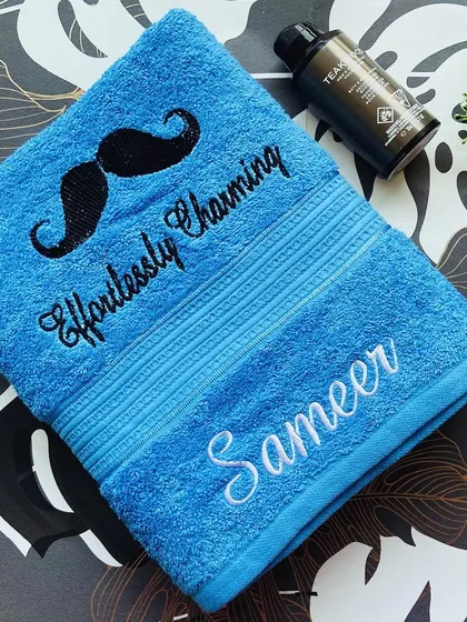 An 'Effortlessly Charming' personalised towel for the man in your life. The mustache embroidery adds a fun and quirky touch.