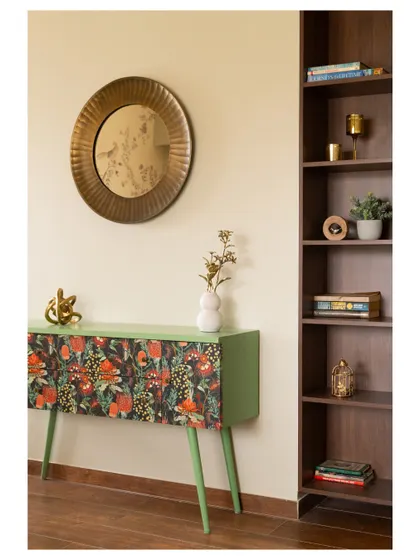 We designed this console table with a vibrant floral print on the drawer fronts, adding a pop of personality and color to the room.