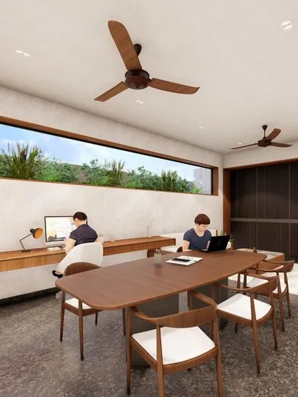 Another view of the home office concept, showing a long picture window that frames the outdoor greenery. The design provides a collaborative work table and quiet reading nooks, all connected to the outdoors.