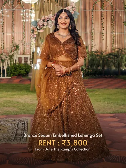 This bronze sequin embellished lehenga set is perfect for an evening reception or cocktail party. It's pure glam for just ₹3,800.