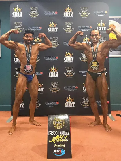 Posing with my medals and fellow INBA Pro Elite Athlete Shodhan Rai. We both continue our fathers' legacies in the sport.