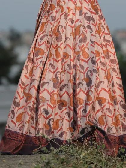 A detail shot of the beautiful paisley-printed fabric of the lehenga skirt.