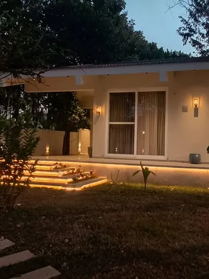 As evening falls at the Amberle resort, the landscape comes alive with light. The illuminated pathways and steps invite guests to explore the gardens after dark.