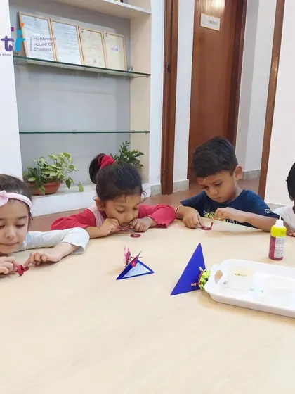 Children carefully assemble their Rakhis, choosing colors and shapes to create a unique design. This is a perfect blend of art and cultural learning.
