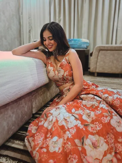 Another relaxed pose in the floral lehenga.