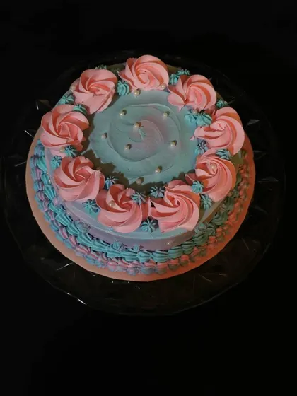 A simple yet pretty cake with pink and blue buttercream rosettes. The two-tone effect gives it a lovely, soft appearance.
