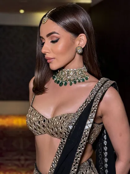 A profile view showing the soft makeup and sleek hair, a perfect combination.