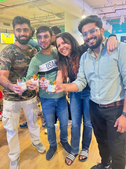 A group of friends showing off the candles they made at our fundraising Christmas party. It's always great to see people having fun while supporting a good cause.