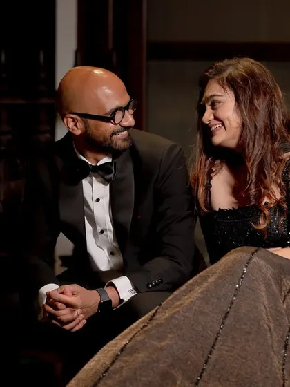 A candid moment of conversation and connection between the couple during their elegant evening reception.