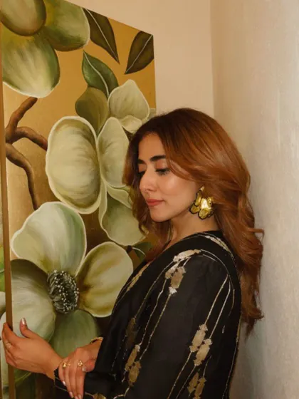 Jonita Gandhi looking elegant and poised, with the statement floral earrings adding a touch of drama to her sophisticated look.