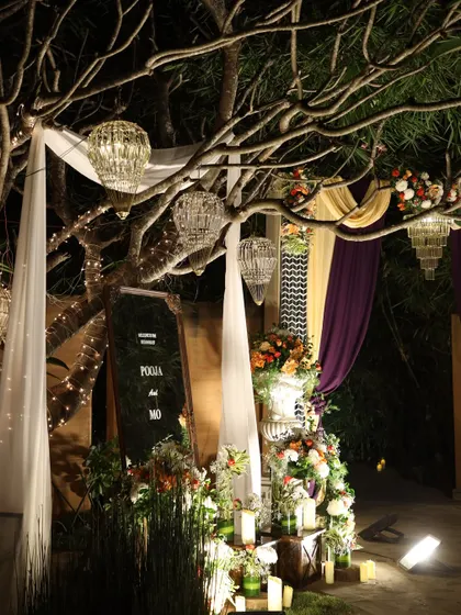 An atmospheric shot of a welcome area at night, with dramatic lighting and elegant decor.