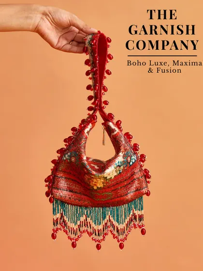 For clients who love a boho-luxe, maximalist aesthetic, I often suggest brands like The Garnish Company. Their bags are full of texture, color, and fusion details.